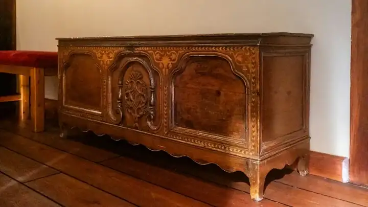 Hand-carved solid-wood furniture made in India — carved cabinet with relief and lattice work
